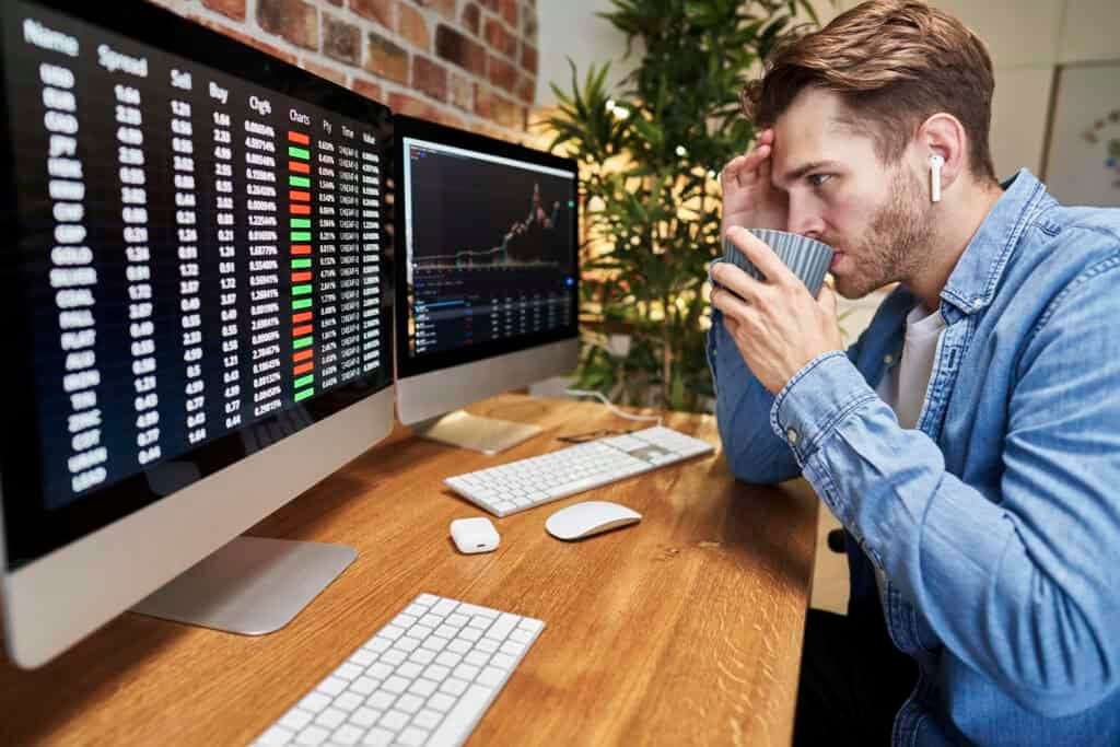 Stock market analysis and young investor studying financial charts for informed investing decisions.