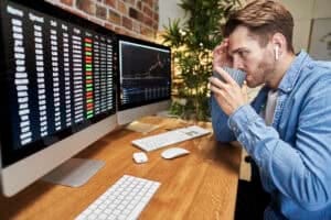 Stock market analysis and young investor studying financial charts for informed investing decisions.
