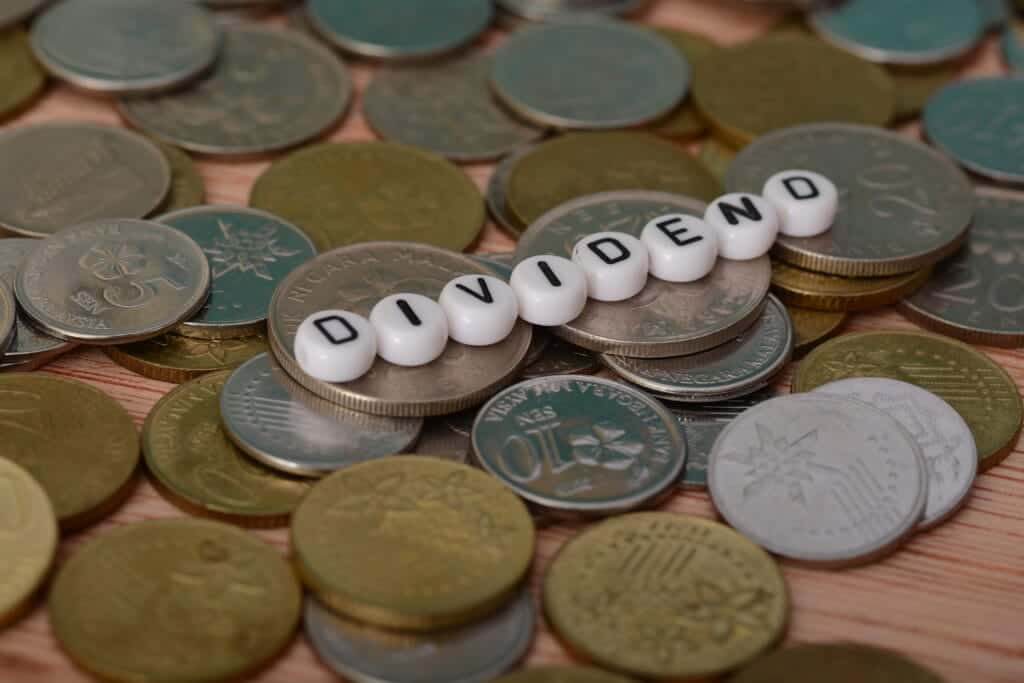 the text dividend is a payment made by a corporation to its shareholders, usually in the form of cash or additional shares of stock